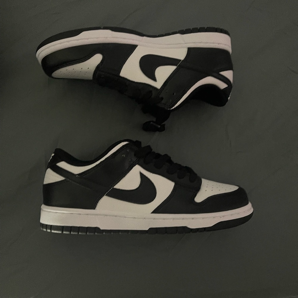 Black and white Nike dunk lows gs